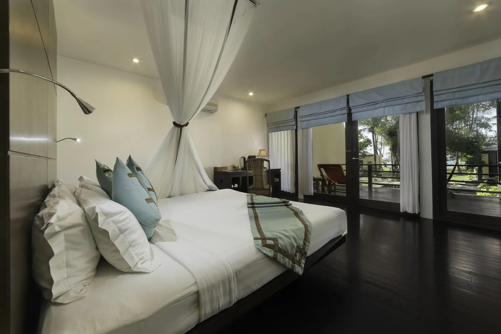Representative hotel room with balcony and desk